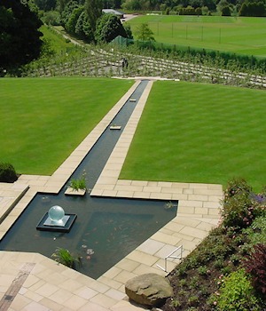 A long stone rill between lawns
