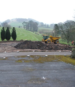 The old car park stripped back, with a dumper truck